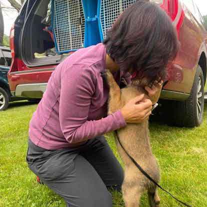 Debbie gettin a hug from puppy Ransom